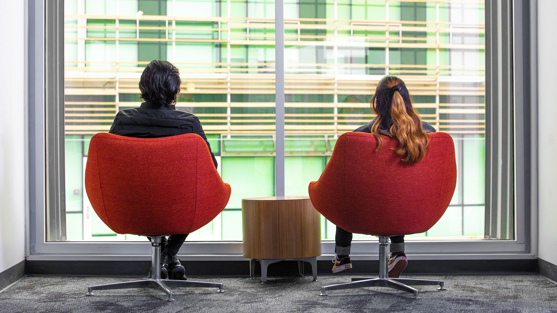 Students sitting in the Business and Information Technology Building