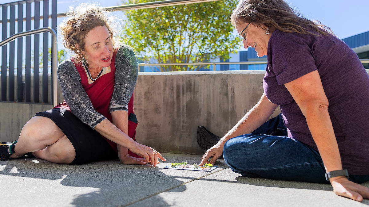 Enid Baxter Ryce, left, works with a participant in the ESTA program.