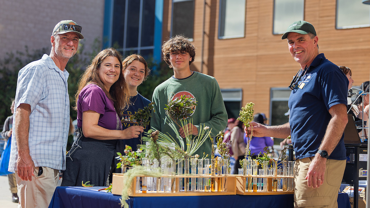 Professor Fred Watson, right, discusses environmental science with visitors at CSUMB's annual Open House.