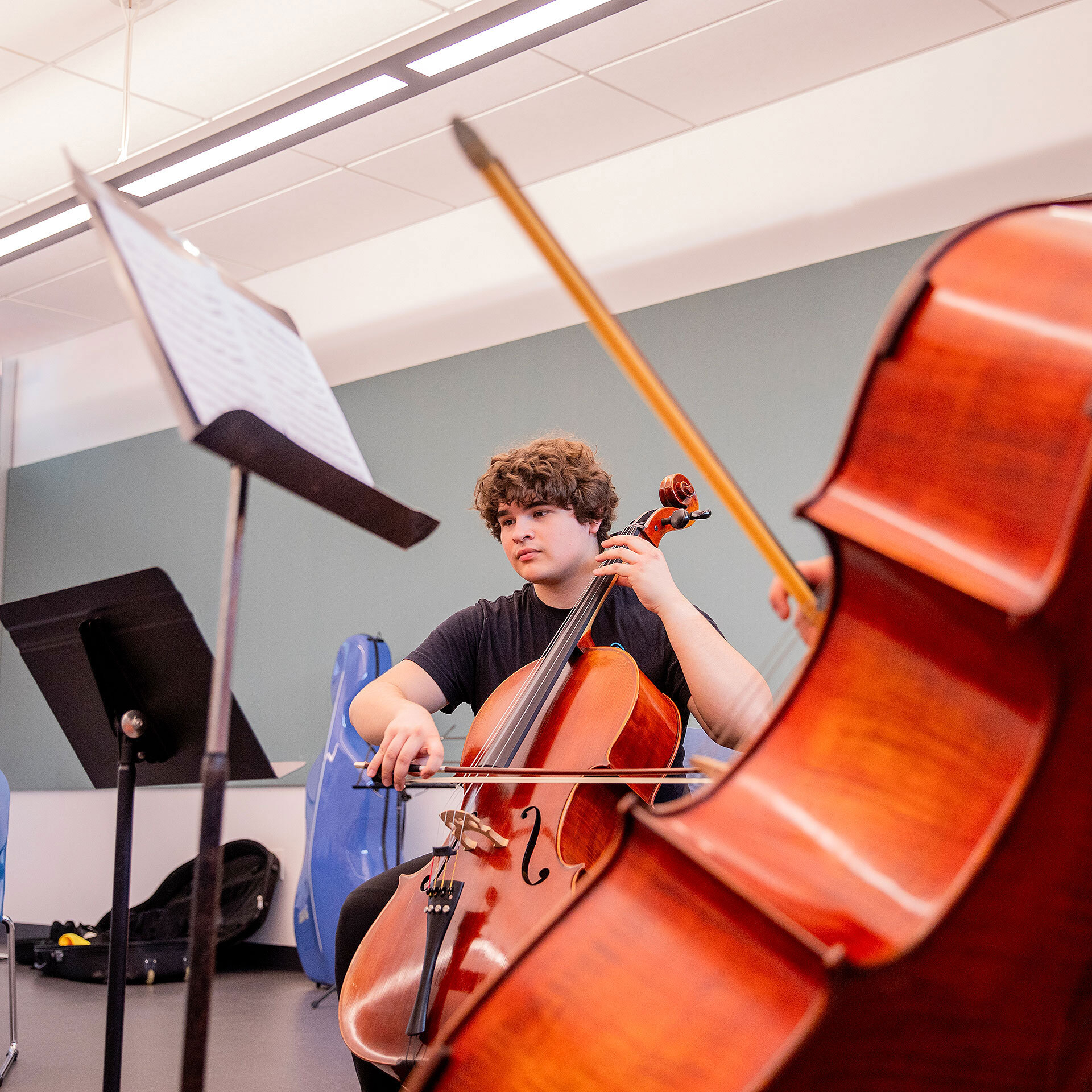 Male student playing the Cello