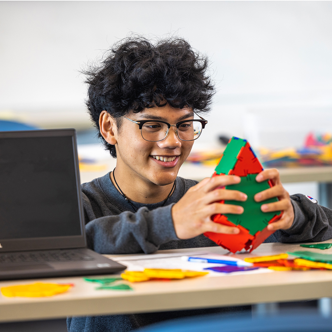 Male student doing a puzzle exercise