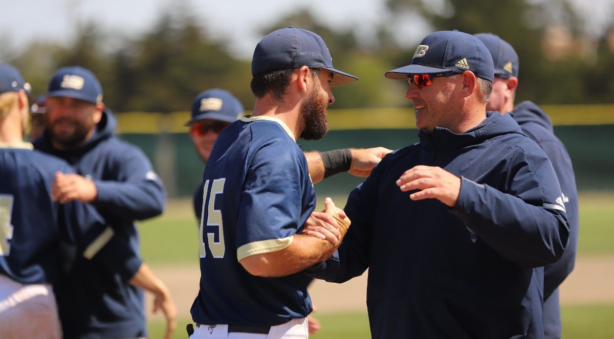 Coach Walt White greeting a player