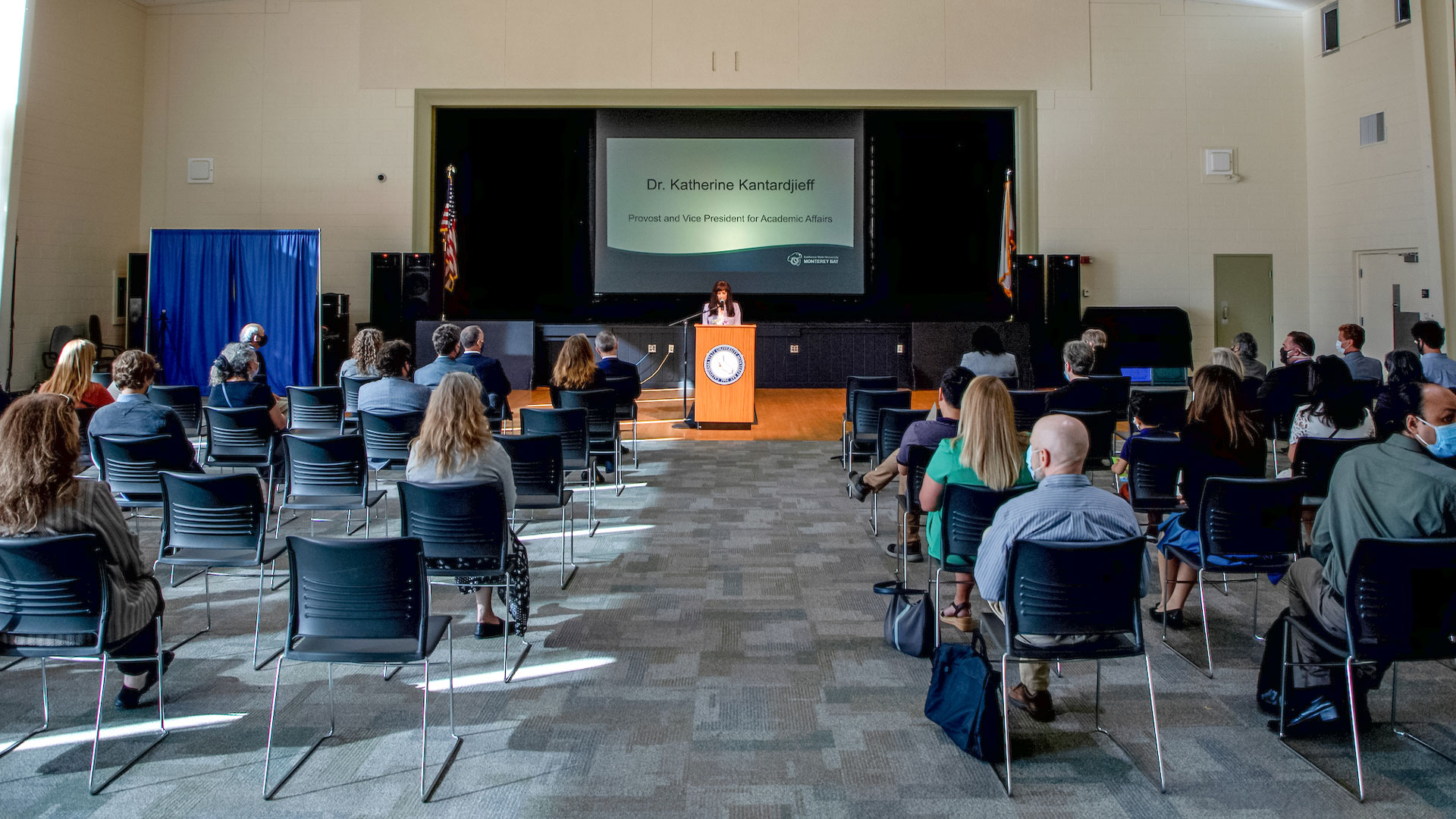 University leadership sit socially spaced apart at University Center