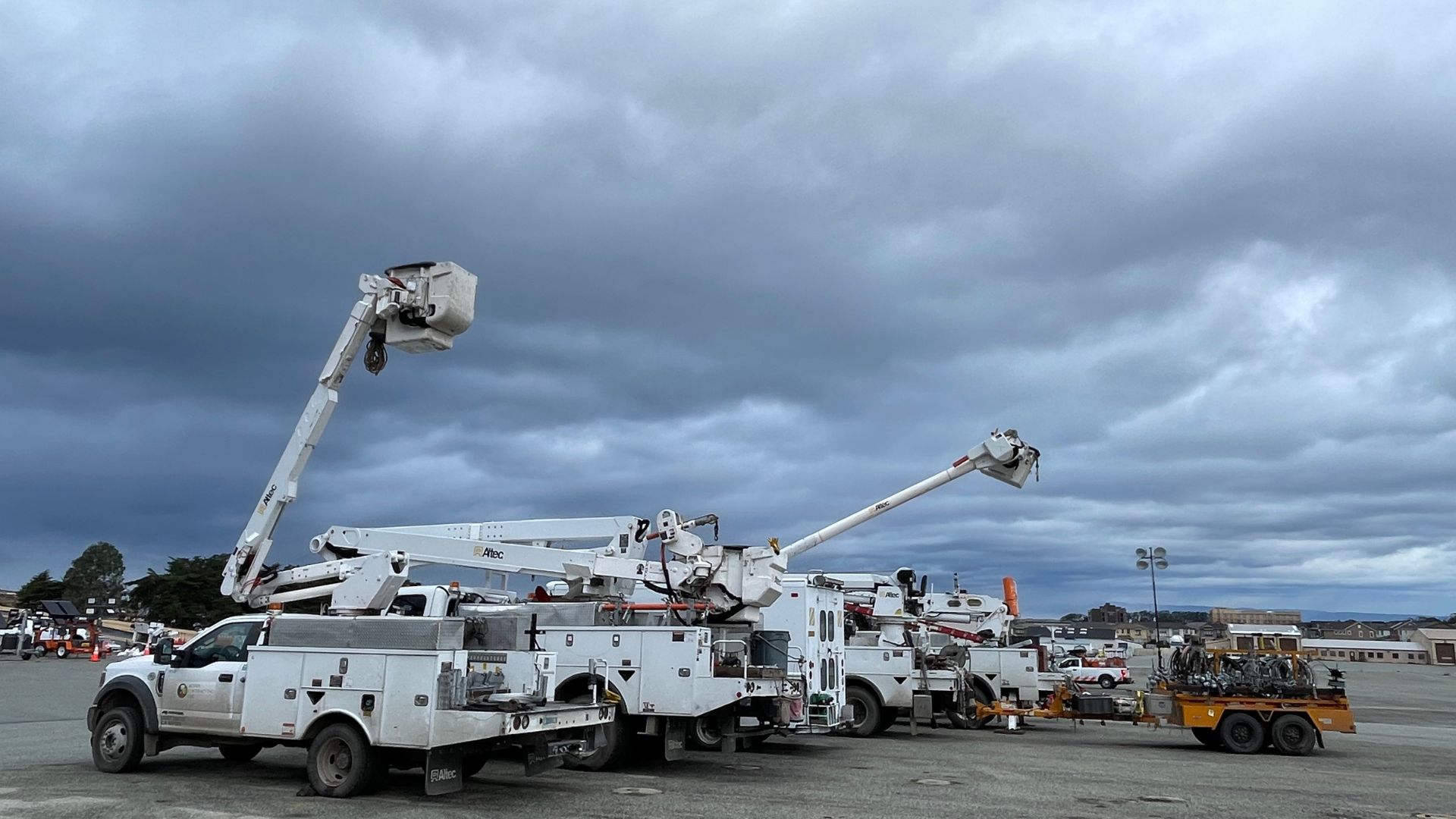 Bucket lift trucks on a CSUMB lot