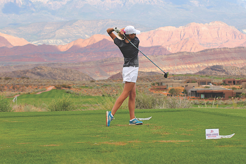 Woman golfing