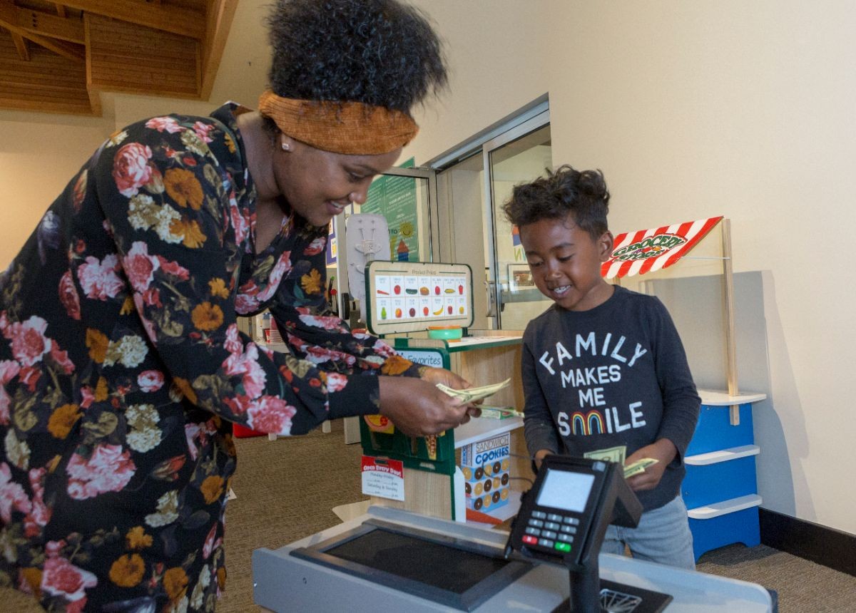 Children and families use the interactive MY Town children's pop up museum at CSUMB at Salinas City Center.