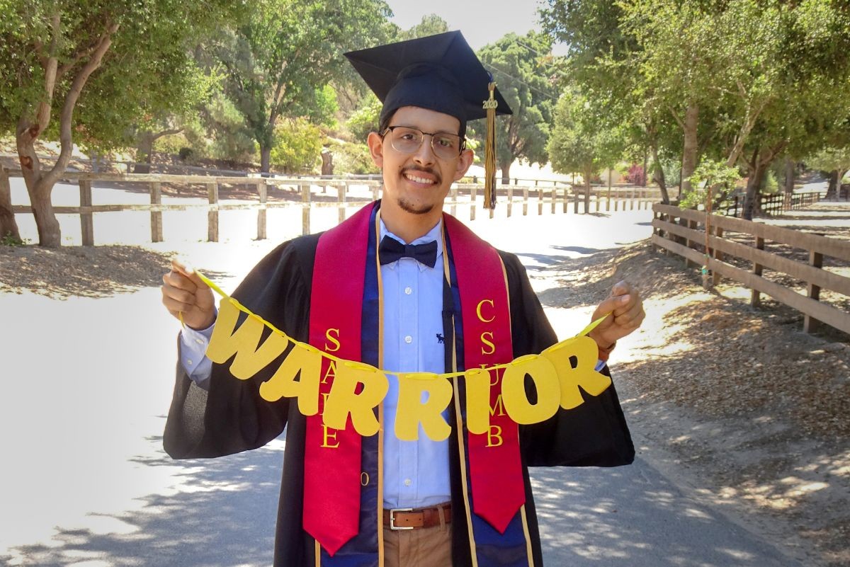 Martin Cisneros Jr. in his graduation cap and gown