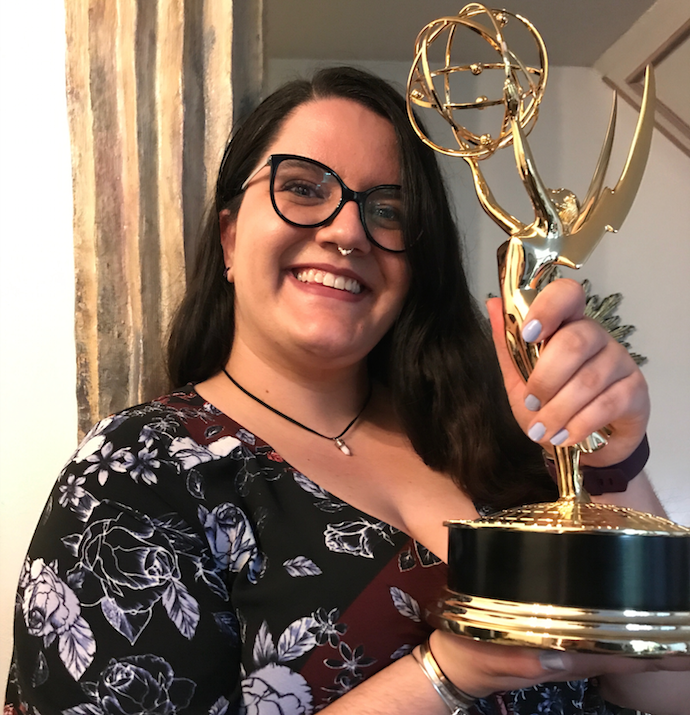 Margo Flitcraft (CART, '13) holds Wonder Women's Daytime Emmy Award