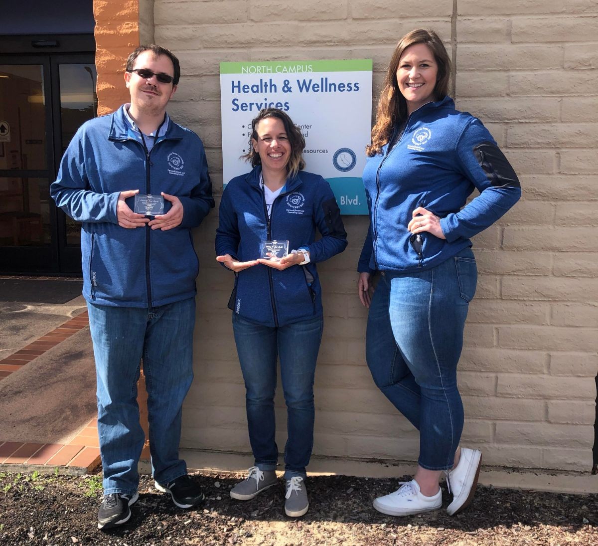 Intern cohorts (from left) Daniel Reed and Mallorey Gatti, with Amy Miller.