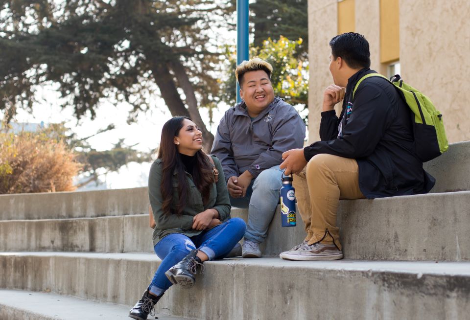 Students sitting down on steps