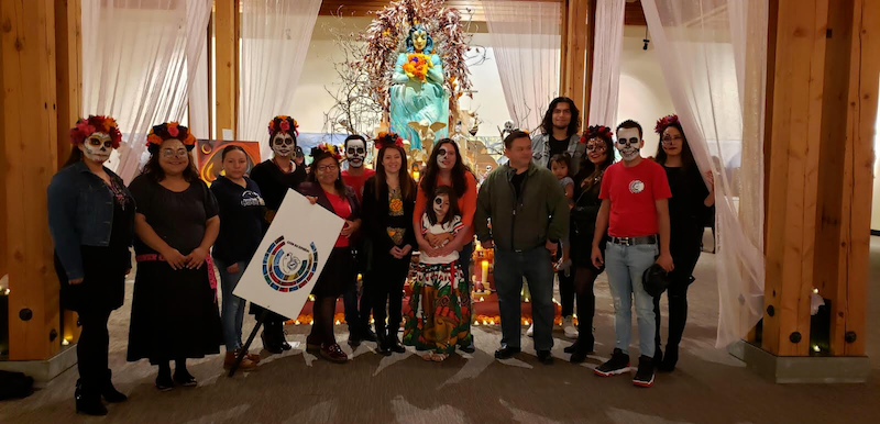 CSUMB and Hartnell Community College Spanish Club members prepare procession