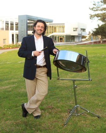 Jeffrey Jones with steel drum with OSU in background