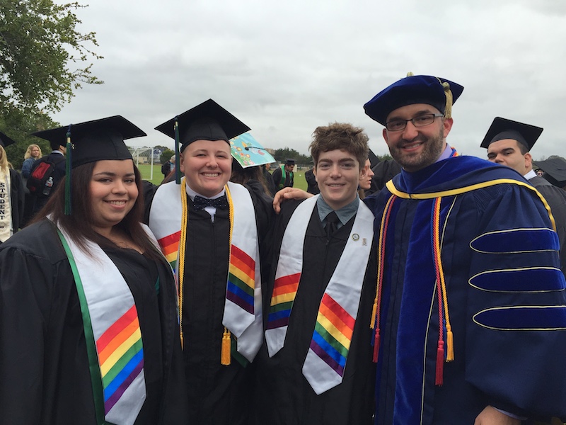 Students posing at commencement