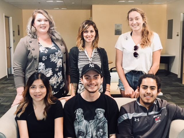 Students and Dr. Snapp standing in a group outside their lab