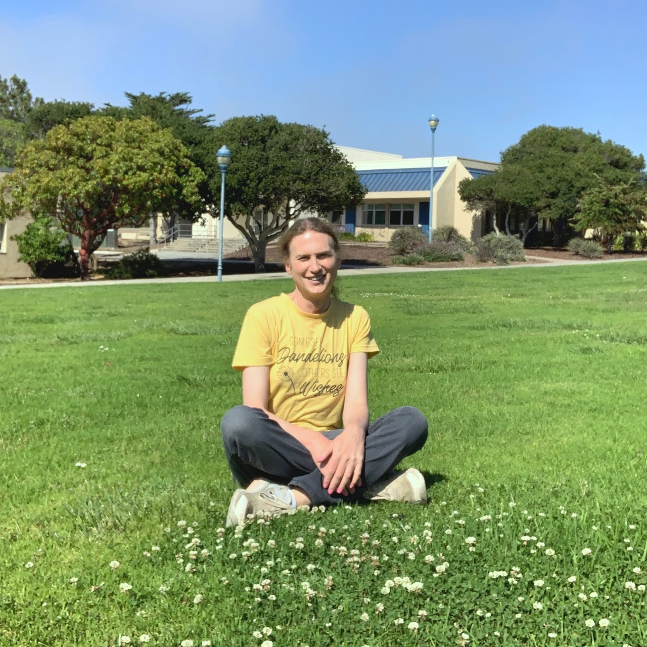 faculty member sitting in a park