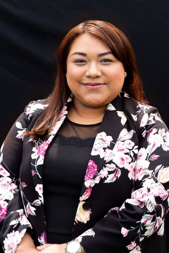 Nery Gonzalez headshot of a WLC graduate in a floral jacket