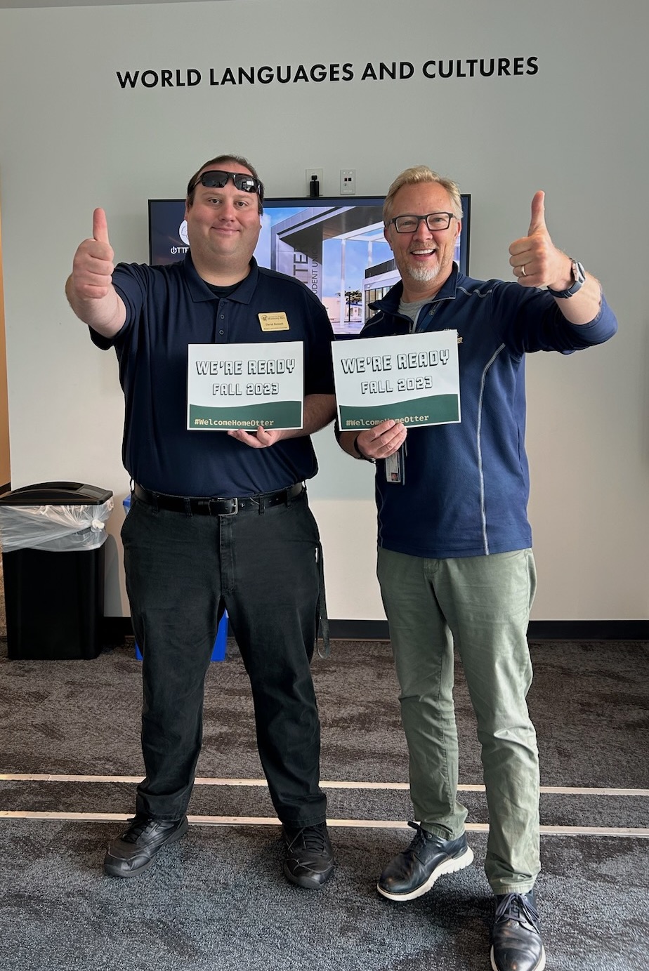 Staff members Gus and David ready for Fall 2023 in lobby of 504/2400 East Wing