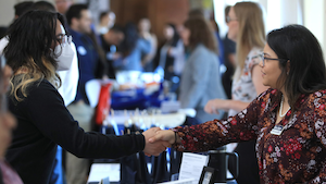 People greeting each other at Accounting Networking Event