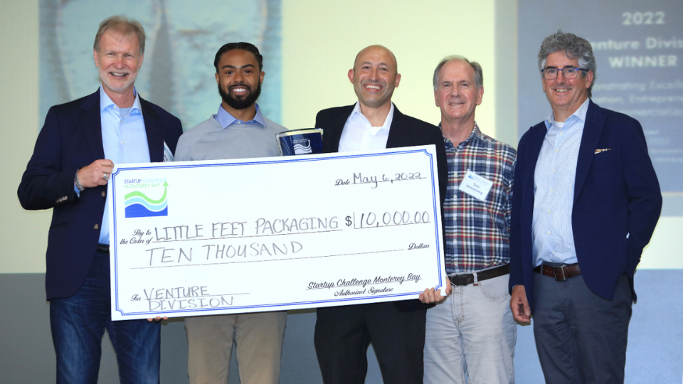 Startup Challenge check with Brad Barbeau, Little Feet Packaging team, Tom Armstrong, Erik Cushman