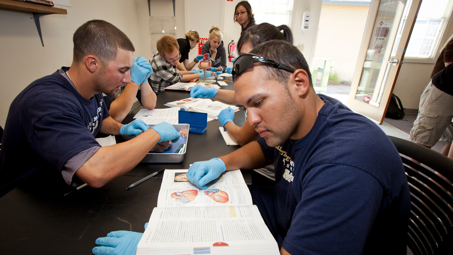 CSUMB students studying science textbooks