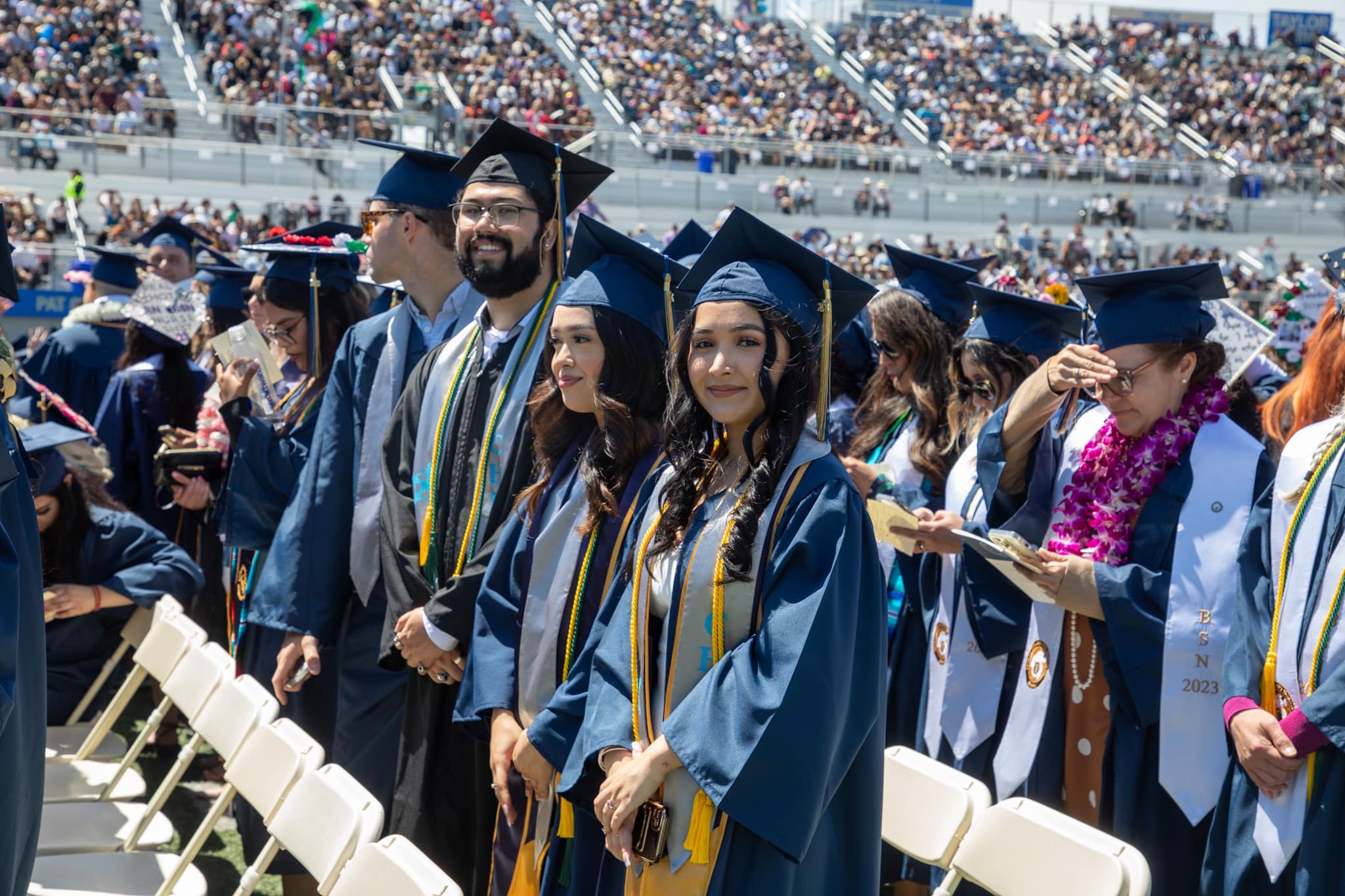 CHHS graduates standing at commencement 2023