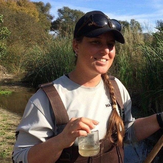 Student holding water sample