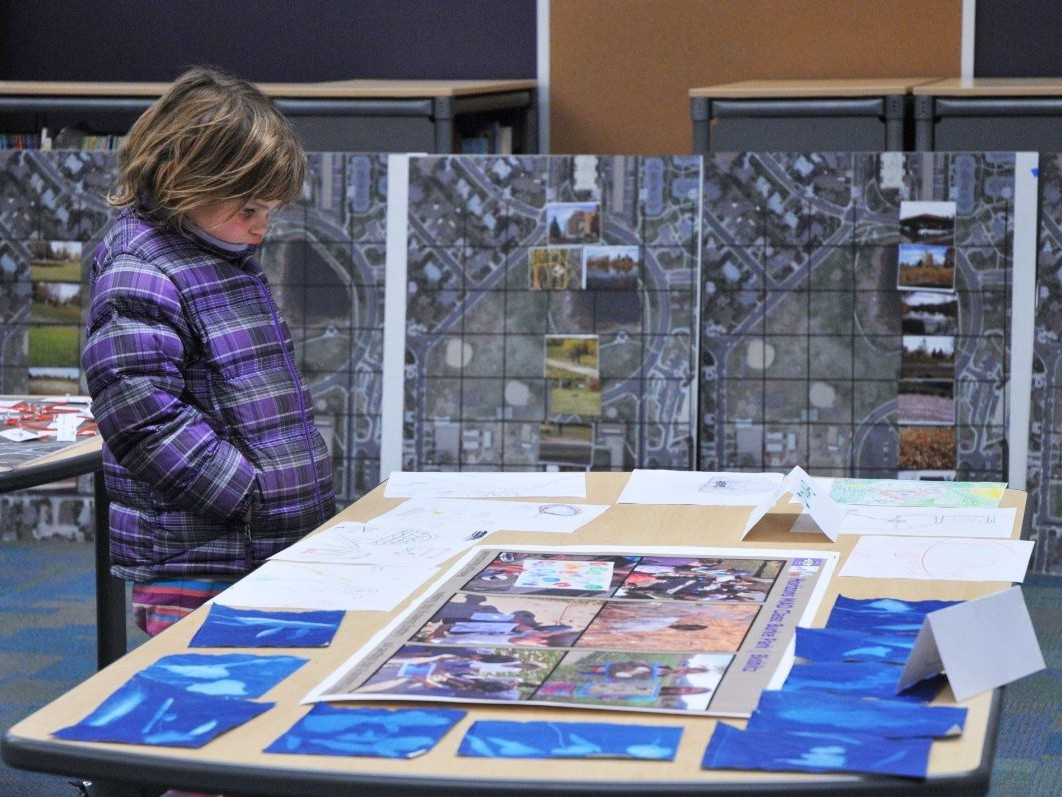 A student viewing educational material on a table