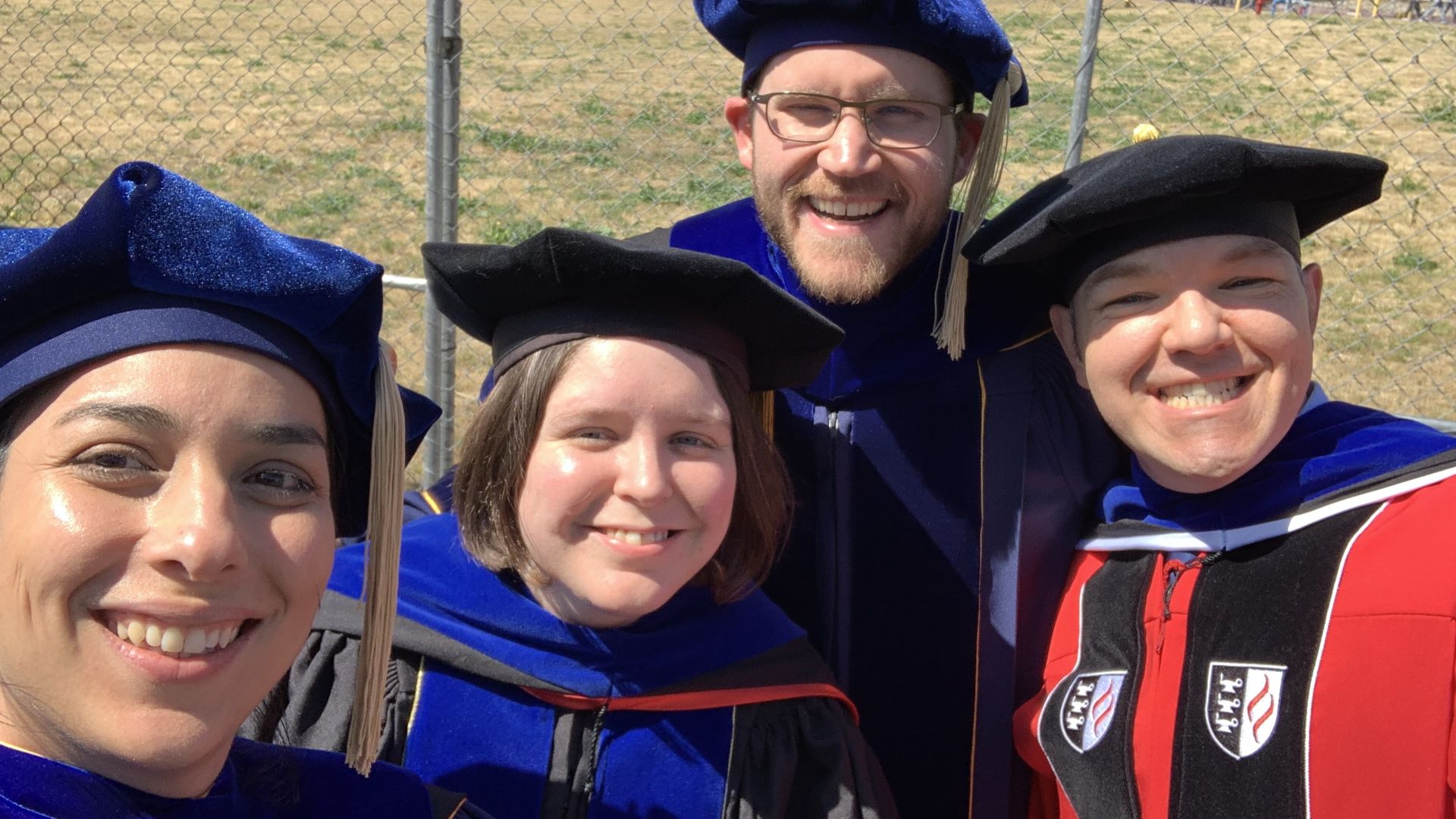 A group of faculty at graduation