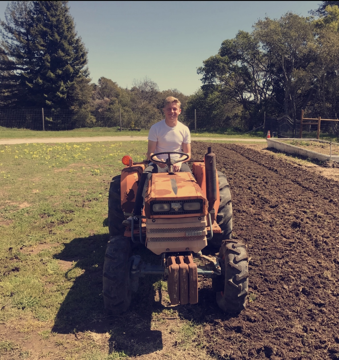 TJ sitting on a tractor