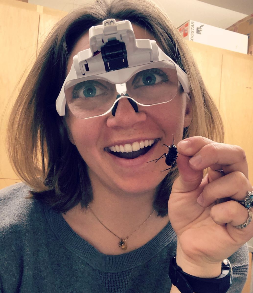 Bridget inspecting an insect