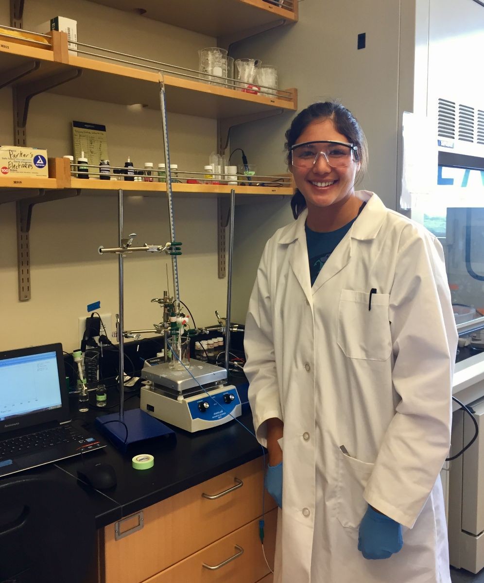 Olivia standing in front of spectrometer