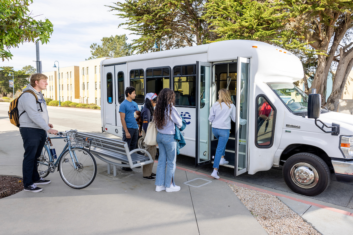 A group of students boarding The Wave Shuttle