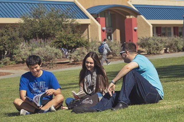 CSUMB students seated in grass