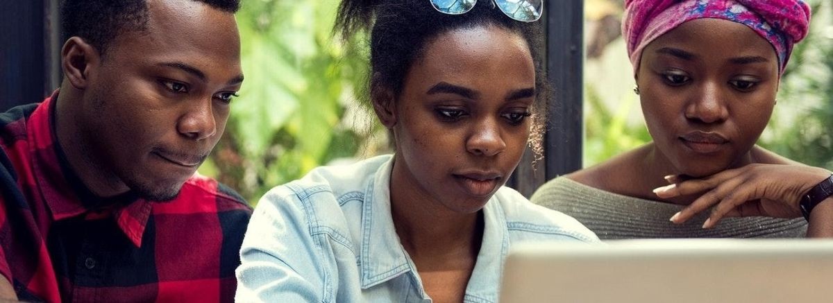 Students of African Heritage looking at a computer screen