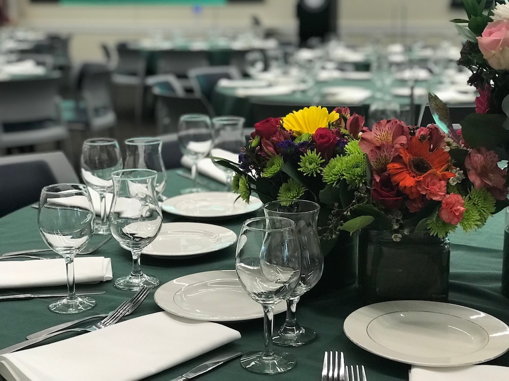 Salinas room set up with tables, and chinaware