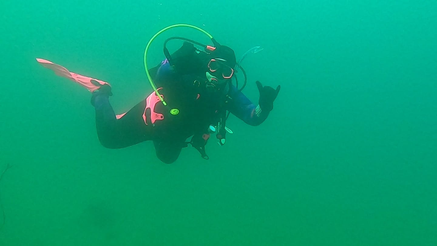 Shelby Scoggin scuba diving with 