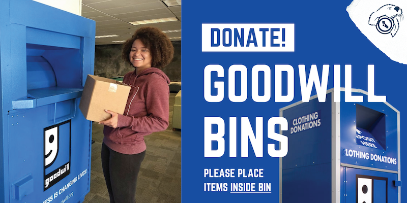 Image of a student donating a box at a goodwill donate station