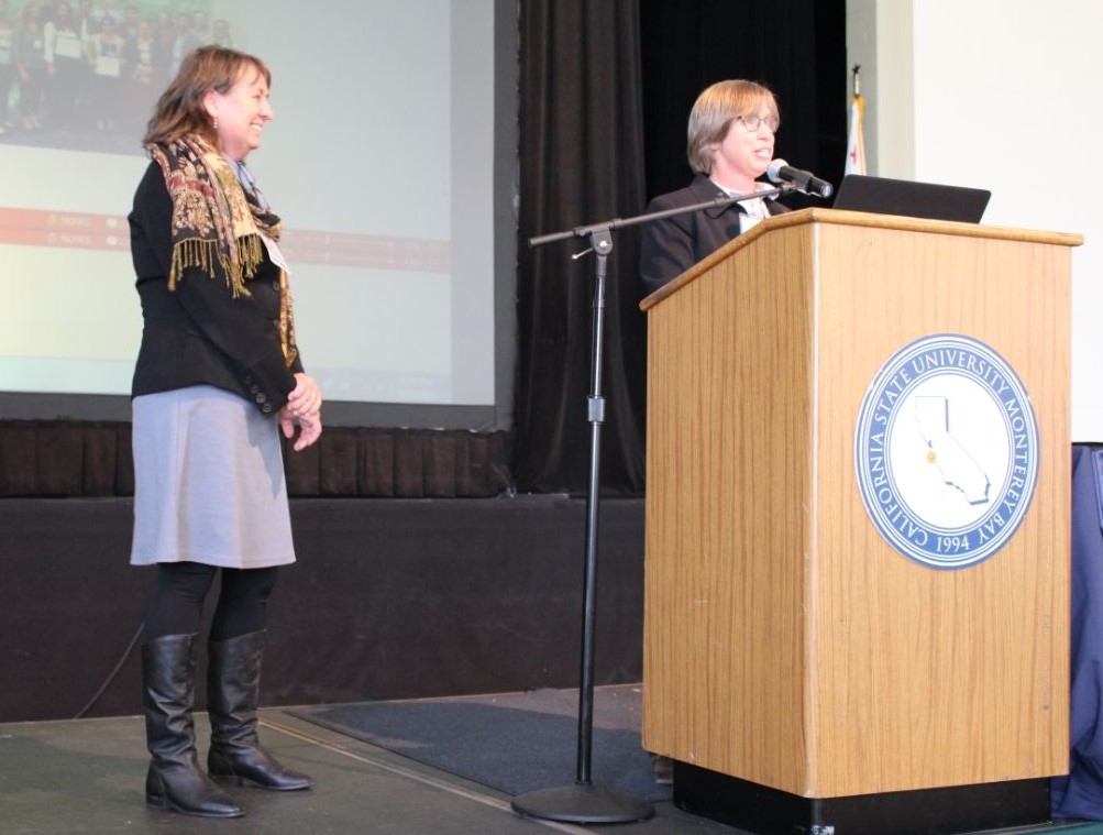 Dr. Anderson (left) presents the Mentor of the Year Award to Dr. Arlene Haffa