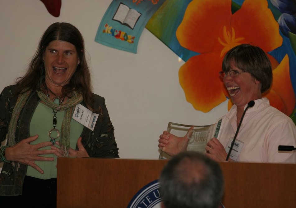 Sharon Anderson (right) presents Dr. Carolee Bull with the UROC Mentor Award.