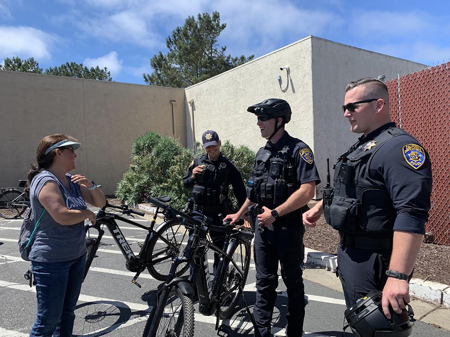 three officers with bikes