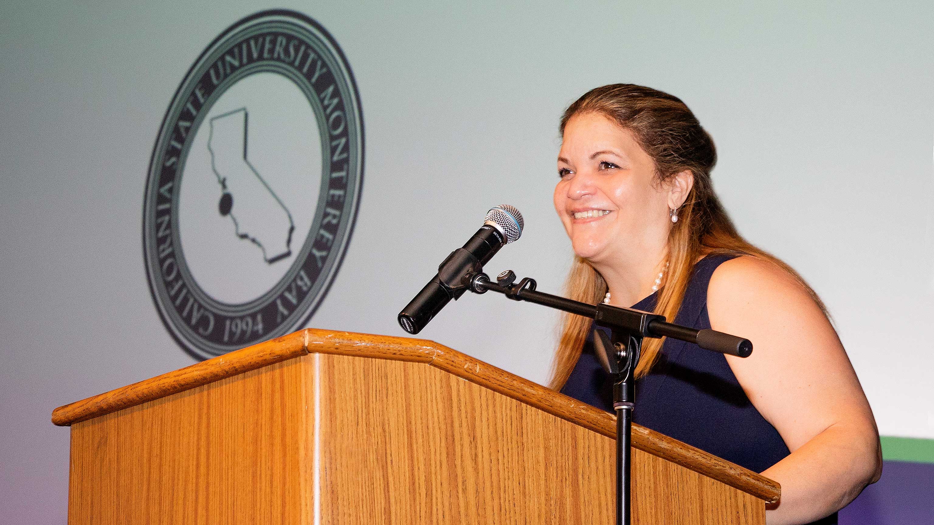 Vayna at podium during Day of Welcome