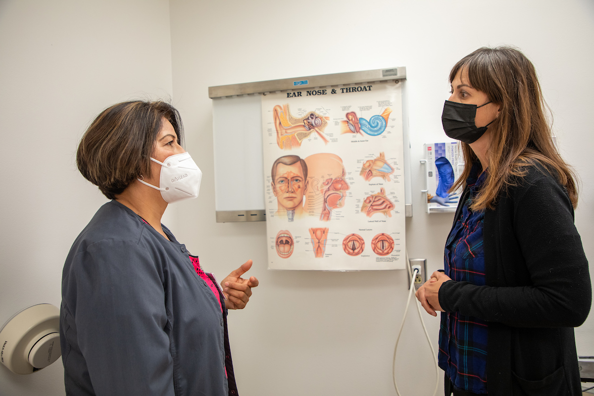 Nursing student and program director in exam room