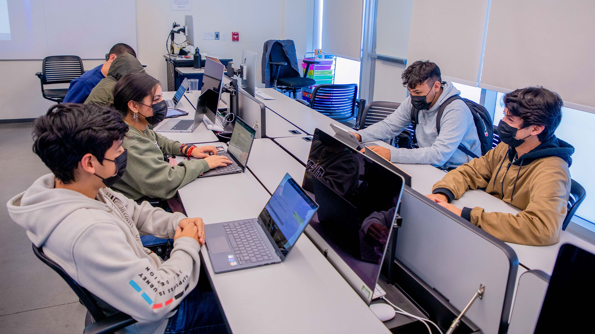 Photo: A group of CTI students on their laptops