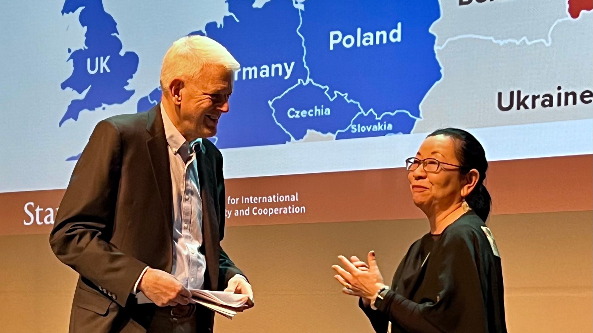 Former Ukranian Ambassador Steven Pifer, left, speaks with Shigeko Sekine after addressing students.