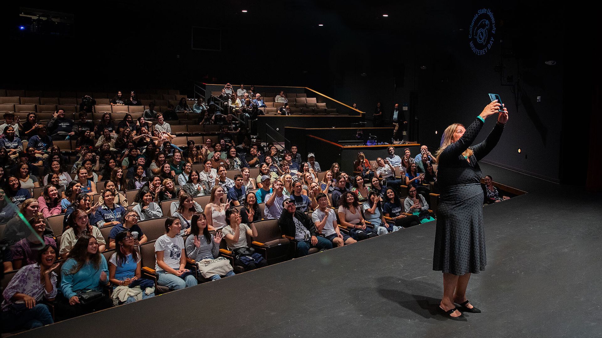 President Vanya Quinones takes a selfie with first-year students