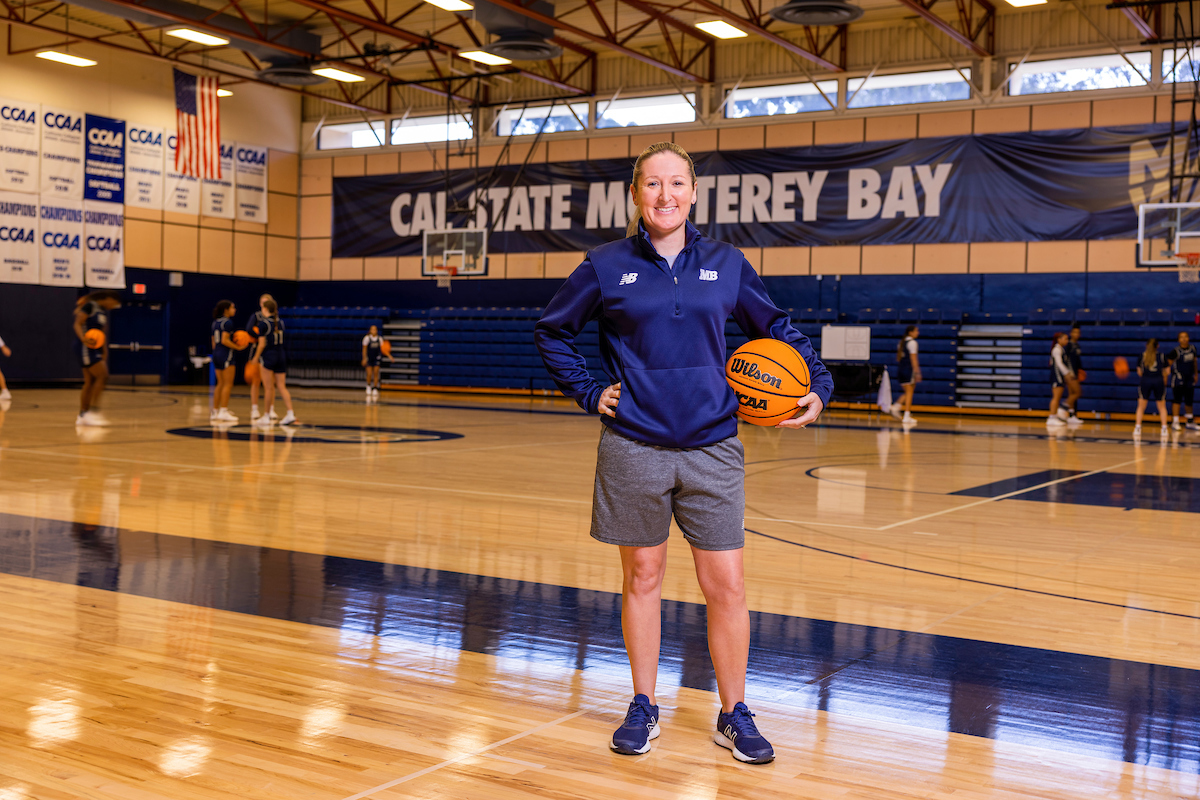 Woman's basketball coach in the gym